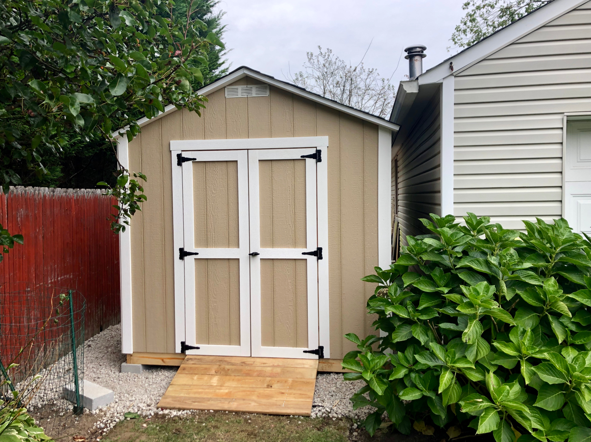 Custom tan storage shed built on-site in Jeffersonville, Indiana
