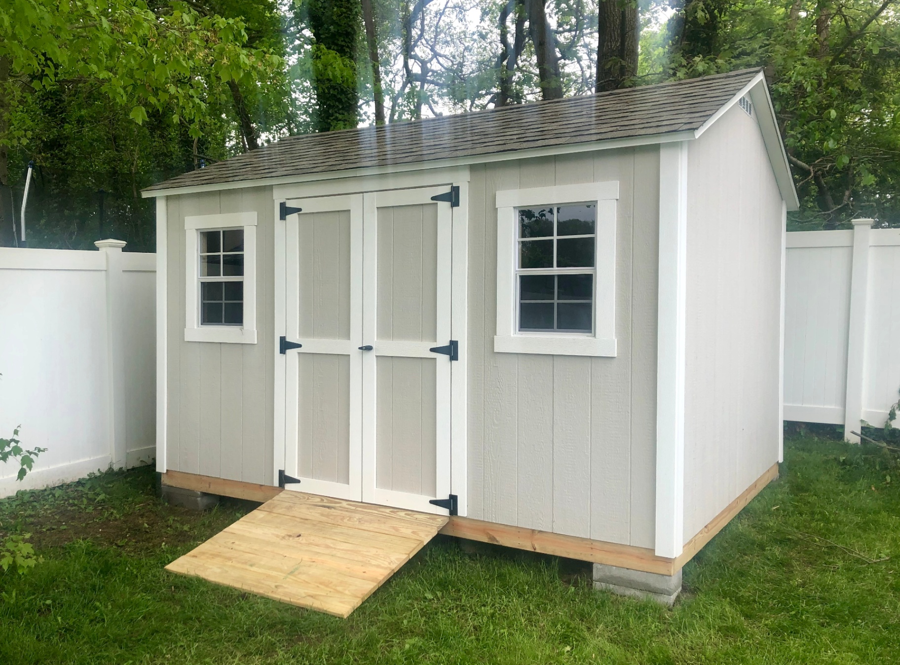 Tan storage shed with window